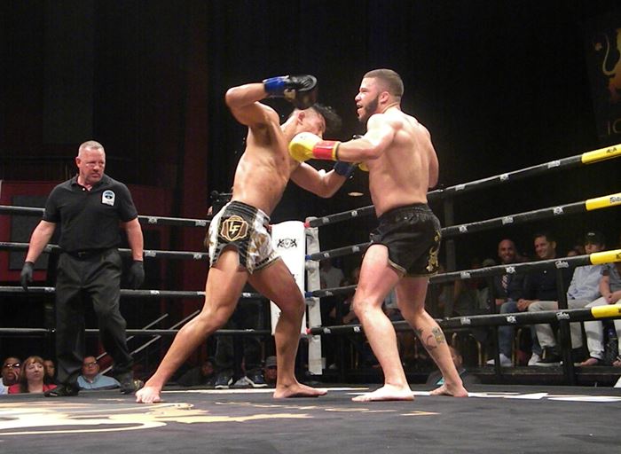 Soap Am, left, throws a punch at Danbury's Geoffrey Then on July 28 at Foxwoods.