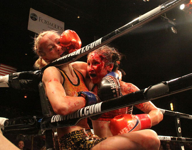 Andra Aho, left, is pinned by a blood drenched Jeri Sitzes on March 3 at Lion Fight 35.