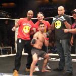 Johnny Lopez, center, celebrates on Jan. 2 at Reality Fighting in the Mohegan Sun Arena.