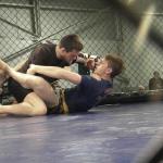 Damian Roofy, left, and Matt Bienia grapple on Feb. 25.